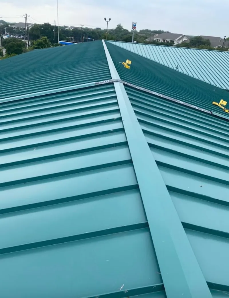 Green commercial metal roof ridge and valley for Metal Roof Repair in Warr Acres